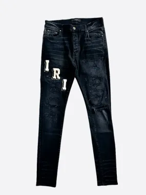 Amiri Faded Black & White Varsity Applique Distressed Jeans