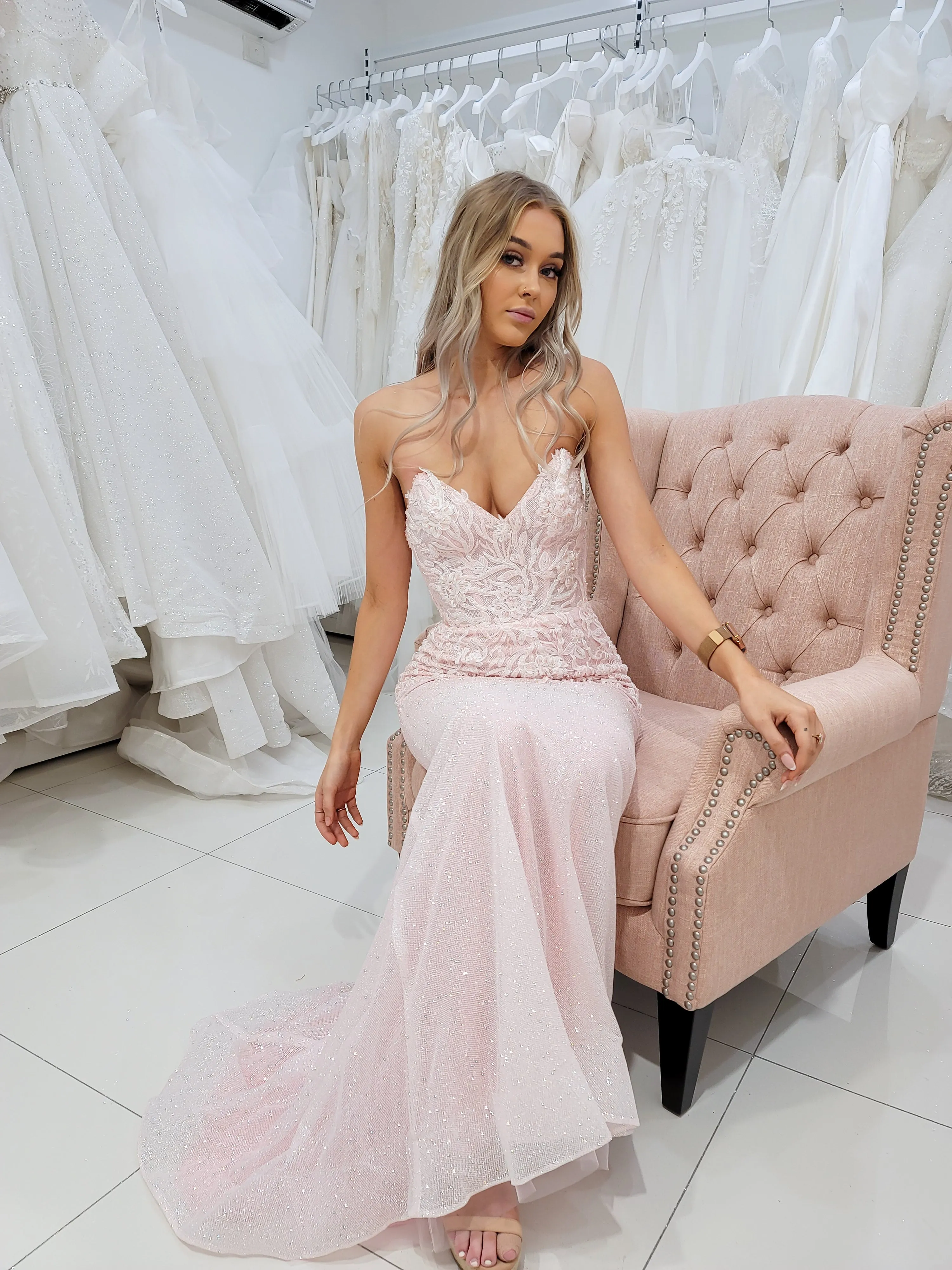 Sparkling pink dress with strapless deep V neckline and corset back