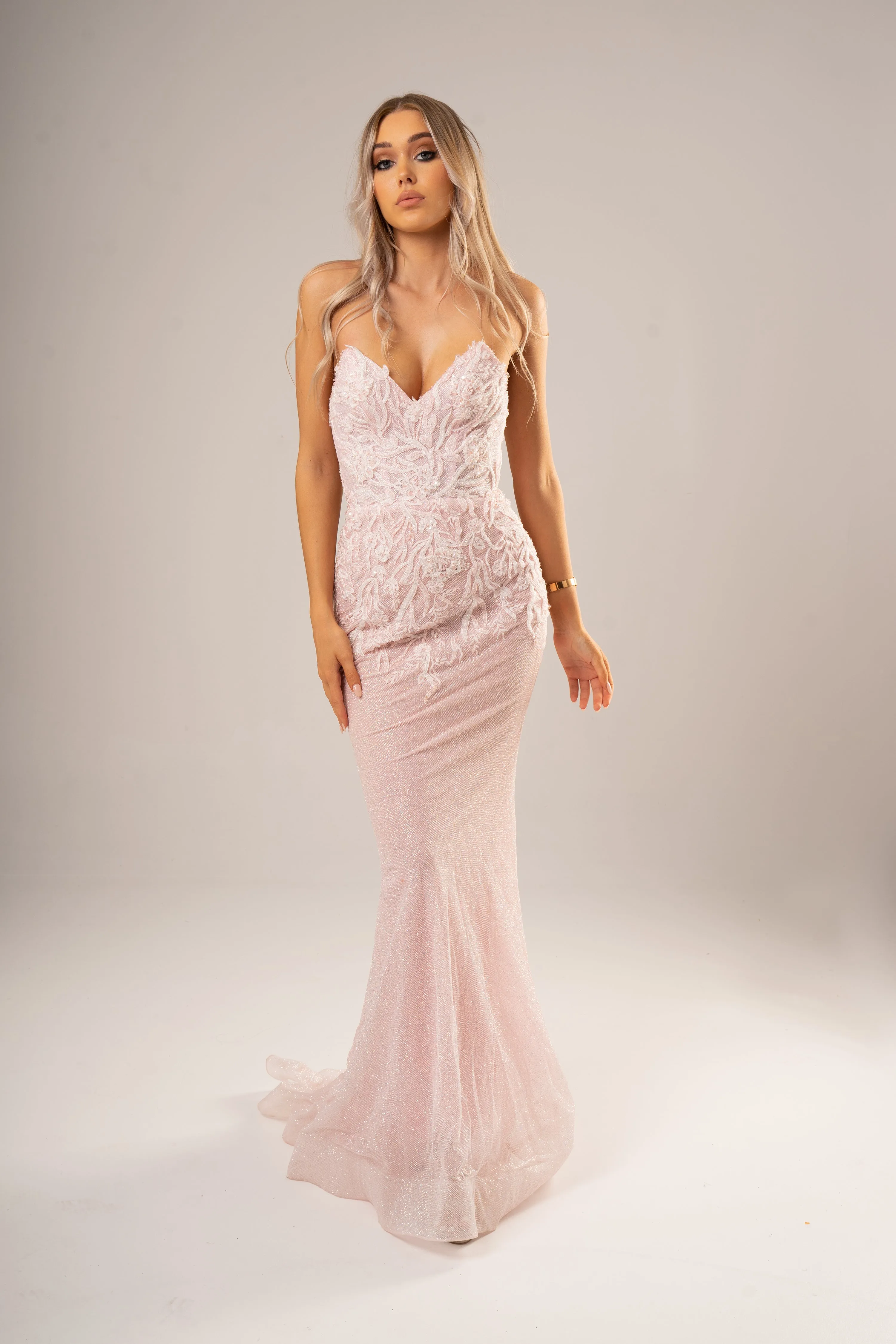 Sparkling pink dress with strapless deep V neckline and corset back